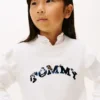 Kinderpullover mit Pailletten-Logo und Rüschen
