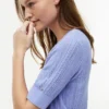 Kurzärmelige Strickjacke aus Mischgewebe Kurzärmelige Strickjacke aus Mischgewebe