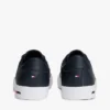 Sneaker aus vulkanisiertem Leder mit Flaggenstreifen Sneaker aus vulkanisiertem Leder mit Flaggenstreifen