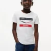 Tommy x Cadillac F1® Team Chevron T-Shirt für Kinder Tommy x Cadillac F1® Team Chevron T-Shirt für Kinder